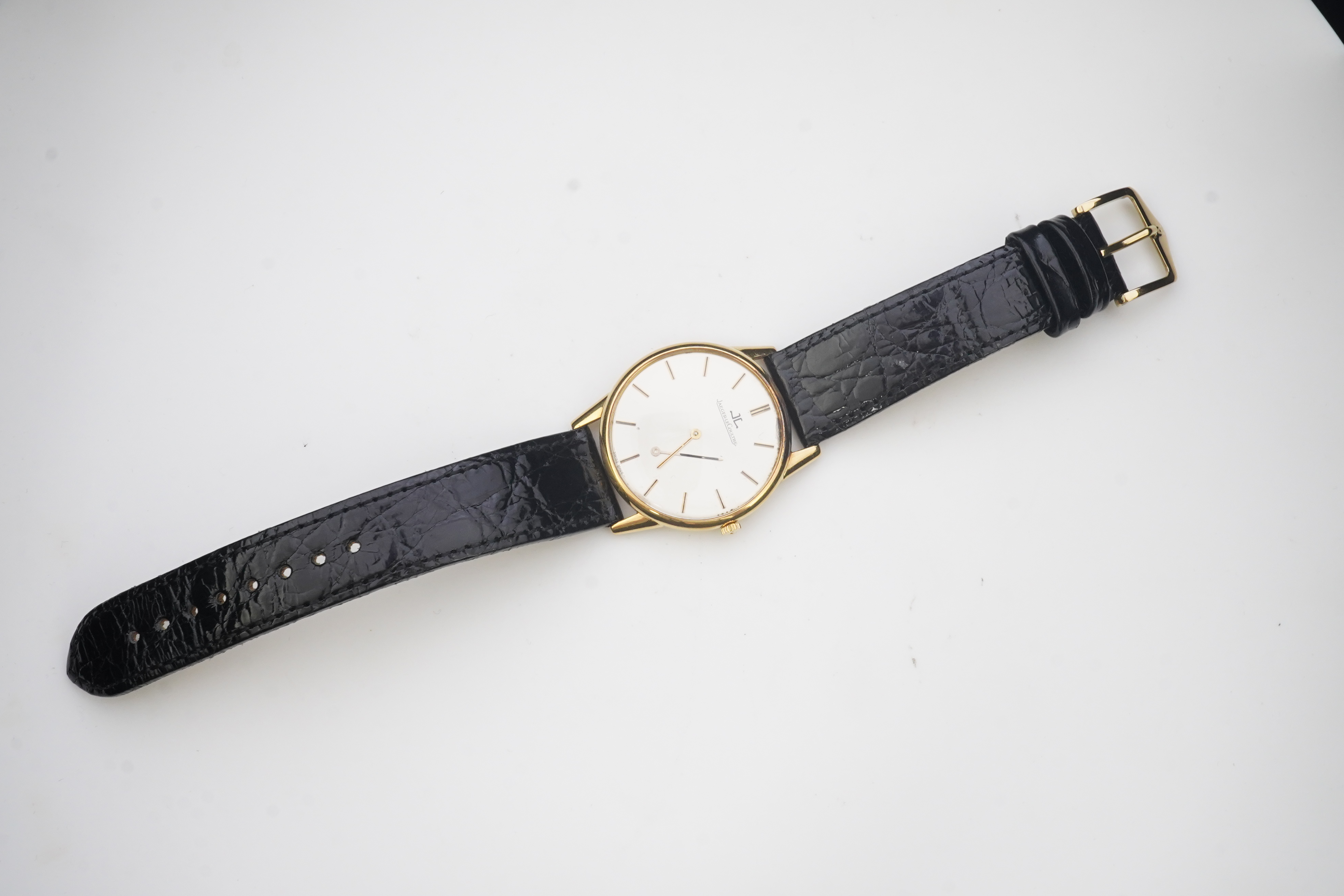 A gentleman's 18ct gold Jaeger LeCoultre manual wind dress wrist watch, on a later associated leather strap